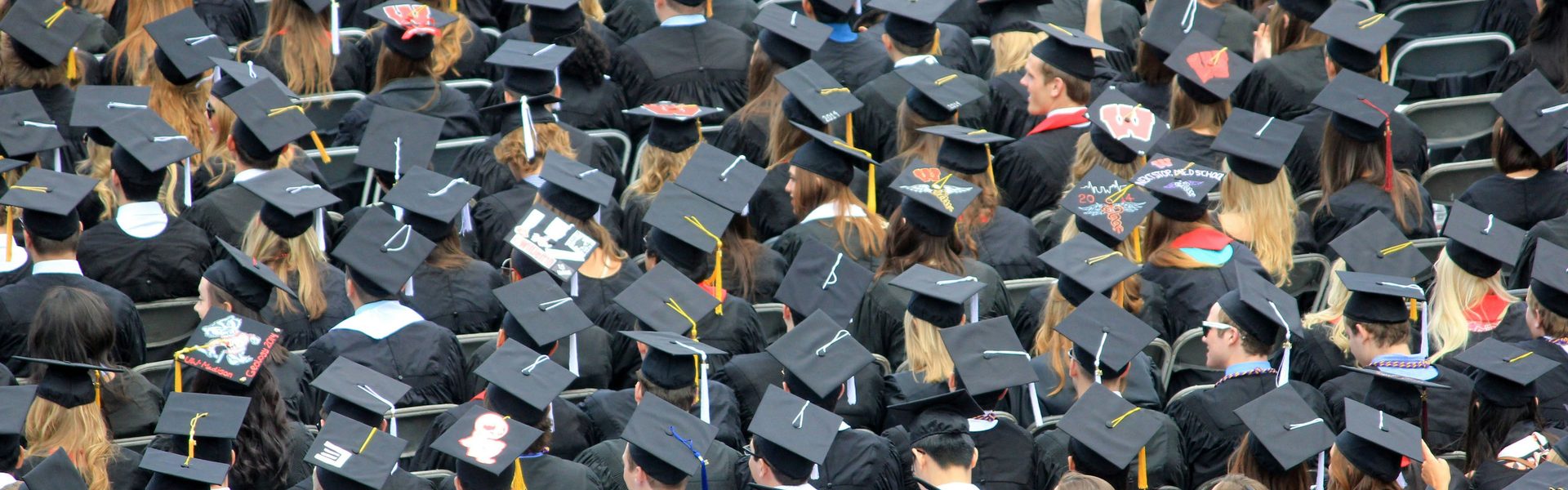 Graduates in caps and gowns, seen from above